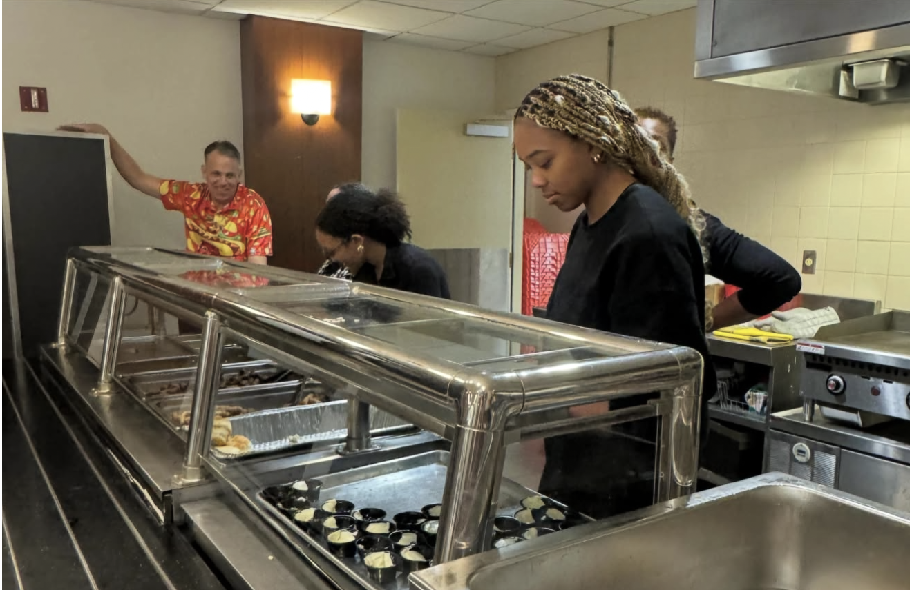 Serving meals at a community outreach event